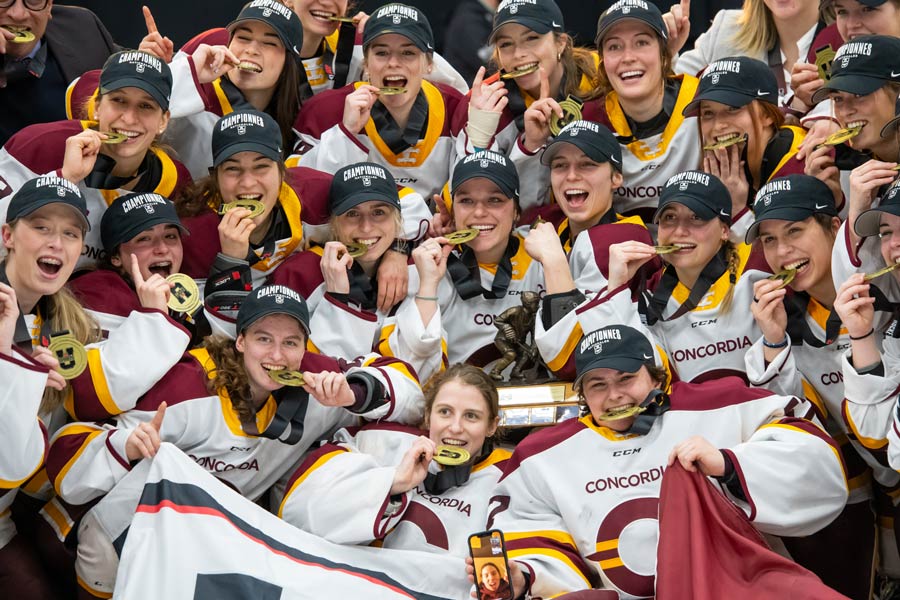 Concordia Players hold their championship medals