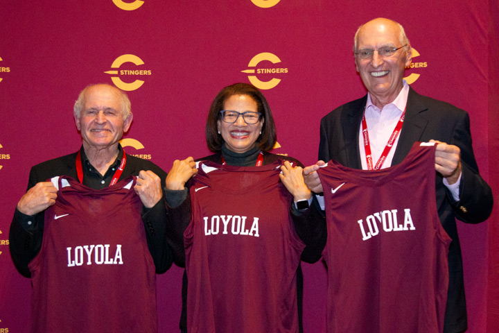 Lauren Winters with two of her father's Loyola players - Harry Hus and George Lengvari.