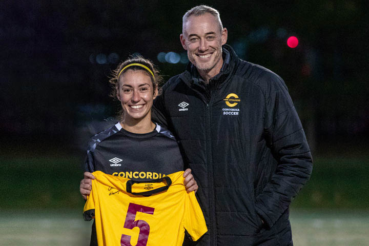 Greg Sutton presented Chloe Ricciardi with her jersey at her final game last October.